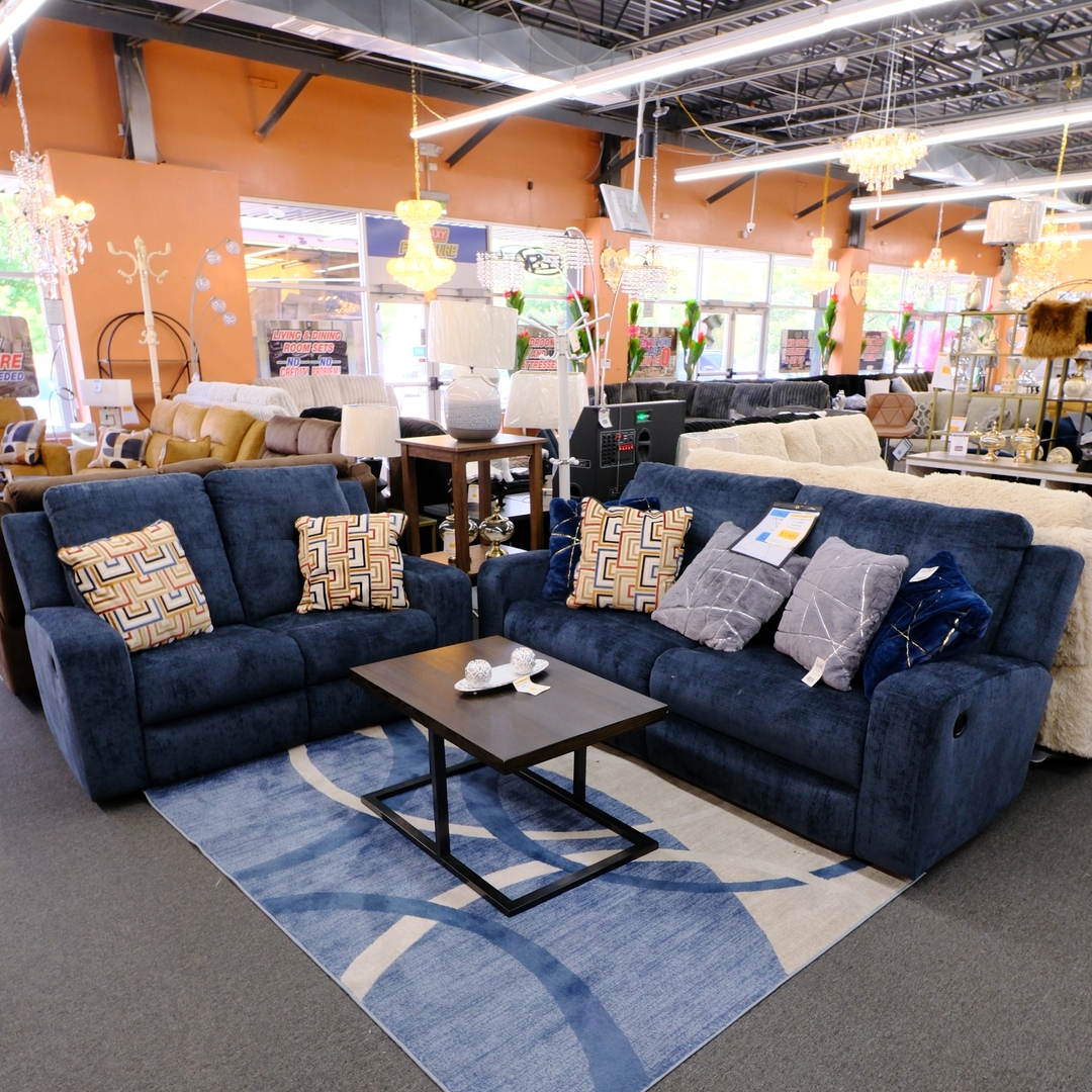 Navy blue reclining sofa and loveseat set in the Galaxy Furniture showroom
